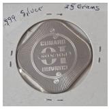 10 Pounds collectible token from the Cunard Line, specifically featuring the Queen Elizabeth 2 ocean liner. ( .999 Silver, 25 grams) - Lot 18