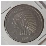 1889  ND Sitting Bull Souvenir Token.  Commemorates the year ND became a state. Featuring a portrait of Sitting Bull on the obverse and an American Seal on the Reverse.  - Lot 21