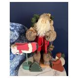 Santa Claus Figurine Display with Wooden Christmas Cutouts Santa Claus Figurine Display with Wooden Christmas Cutouts