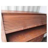 Antique rolltop desk with lots of s...