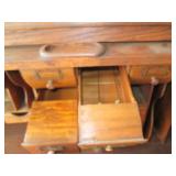 Antique rolltop desk with lots of s...