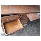Antique rolltop desk with lots of s...