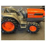 Two Kubota L5030 Toy Tractors with Disney Plush Toys & Wooden Blocks in Sterilite Tote