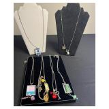 Assorted Silver-Tone Pendant Necklaces with Charms, Beads & Keys in Display Case