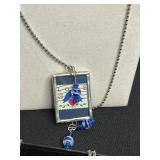 Assorted Silver-Tone Pendant Necklaces with Charms, Beads & Keys in Display Case