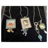 Vintage Stamp Pendant Necklaces & Rhinestone Brooches in Display Case - brooches missing stones or pins