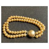 Double-Strand Pearl Bead Bracelet (unauthenticated) & Cream Textured Bead Stretch Bracelet with Black Faceted Accent