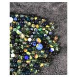 Lot of Collectible Marbles - some of them glow green when hit with a black light