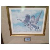 Framed, signed and numbered 1987 Wildlife Habitat print and stamp "On the Wing-Canada Geese" by George McLean with papers 11,102/16,000