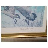Framed, signed and numbered 1987 Wildlife Habitat print and stamp "On the Wing-Canada Geese" by George McLean with papers 11,102/16,000