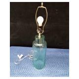 Lt. Green glass lamp with hollow bottom
