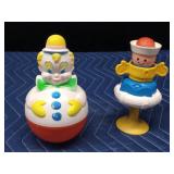 2 vintage toys - 1977 Sanitoy Roly Poly musical chime clown and a 1984 Fisherprice sailor suction cup rattle & squeak toy