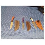 3 Handmade Damascus steel knives with Pakkawood handles and a stag antler handle knife. All with sheaths
