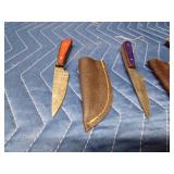 3 Handmade Damascus steel knives with Pakkawood handles and a stag antler handle knife. All with sheaths