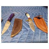 3 Handmade Damascus steel knives with Pakkawood handles and a stag antler handle knife. All with sheaths