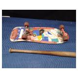 Skateboard and a wood baseball bat