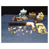Box of collectibles including a jar of gold flakes, music recorder, and Ninja Turtle lunch box