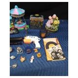 Box of collectibles including a jar of gold flakes, music recorder, and Ninja Turtle lunch box