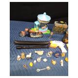 Box of collectibles including a jar of gold flakes, music recorder, and Ninja Turtle lunch box