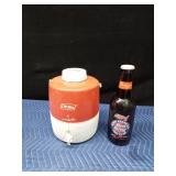 Coleman water cooler and a large Budweiser collector bottle