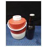 Coleman water cooler and a large Budweiser collector bottle