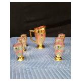 Gold and rose colored pitcher and 6 glasses