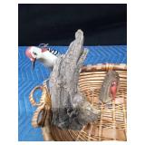 Basket of ceramic and wood birds (some on drift wood)