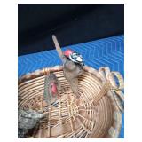 Basket of ceramic and wood birds (some on drift wood)