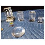 Crystal glass paperweights with different things etched inside and other crystals and more