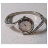 Vintage Bangle Cuff Fashion Watch with a Silver-Toned Metal Band and White Dial and a Geneva Platinum Branded Women