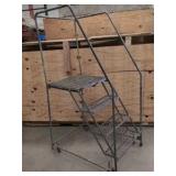 Warehouse rolling ladder