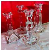 4 clear glass candlestick holders, 1 etched