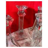 4 clear glass candlestick holders, 1 etched