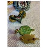 Group of military and merit award pins Norwegian cap badges