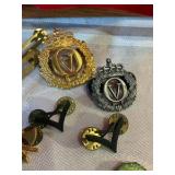 Group of military and merit award pins Norwegian cap badges