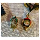 Group of military and merit award pins Norwegian cap badges