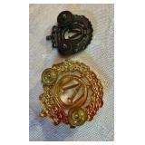 Group of military and merit award pins Norwegian cap badges