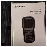 The Foxwell T1000 diagnostic tool used to activate, decode and program tire pressure (TPMS) sensor