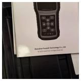 The Foxwell T1000 diagnostic tool used to activate, decode and program tire pressure (TPMS) sensor