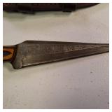 Fixed-blade knife with a distinctive Damascus steel blade - nice leather sheath