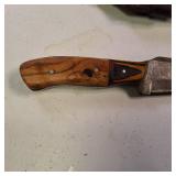 Fixed-blade knife with a distinctive Damascus steel blade - nice leather sheath