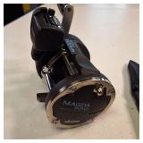 Attn Fishermen:  Okuma Magda Pro line counter trolling reel, long with a companion knife