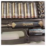 Quinn brand socket set with a ratchet and various sockets