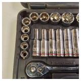 Quinn brand socket set with a ratchet and various sockets