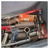 Plano 16-inch tool box with a variety of assorted hand tools and hardware.