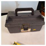 Plano 16-inch tool box with a variety of assorted hand tools and hardware.