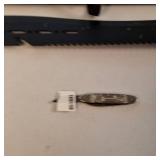 The BIG and the small.... a large, black survival-style knife and its matching nylon sheath :: a smaller folding pocket knife.