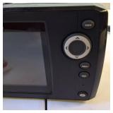 Humminbird HELIX 5 Sonar G2 fish finder unit along with its gimbal mounting hardware.