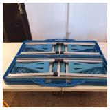 GoDecor camping table in blue, which folds into a compact carrying case