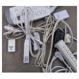 LOT OF EXTENSION CORDS AND SURGE PROTECTERS